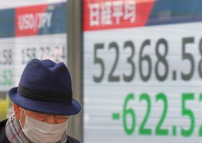 BOJ keeps rates steady, raises growth forecasts