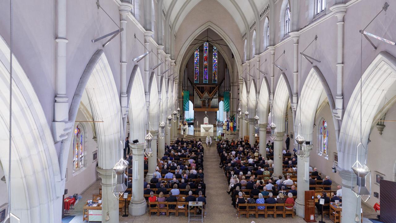 Mourners attend the state funeral for Ronald Boswell