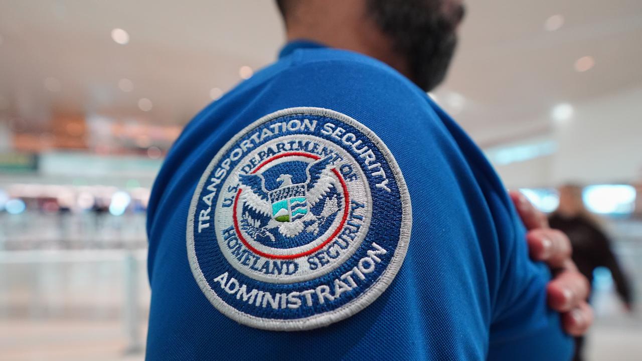A TSA agent wears a U.S. Department of Homeland Security patch
