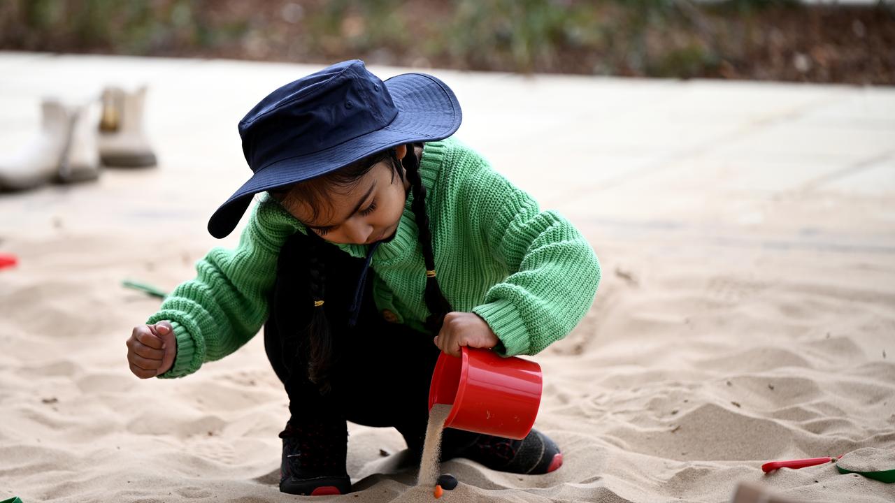 A child plays in a sandpit