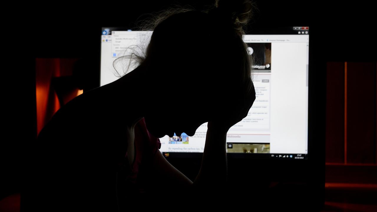 Upset girl in front of a personal computer in Brisbane