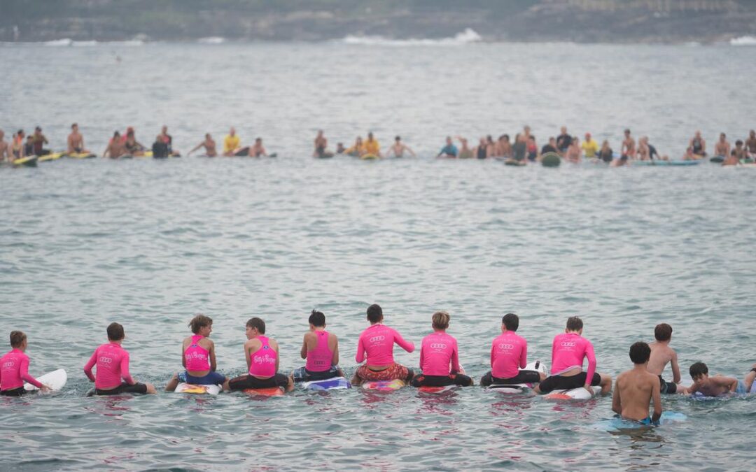 ‘Loved life’: mass paddle-out for young shark victim
