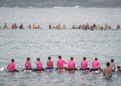 ‘Loved life’: mass paddle-out for young shark victim