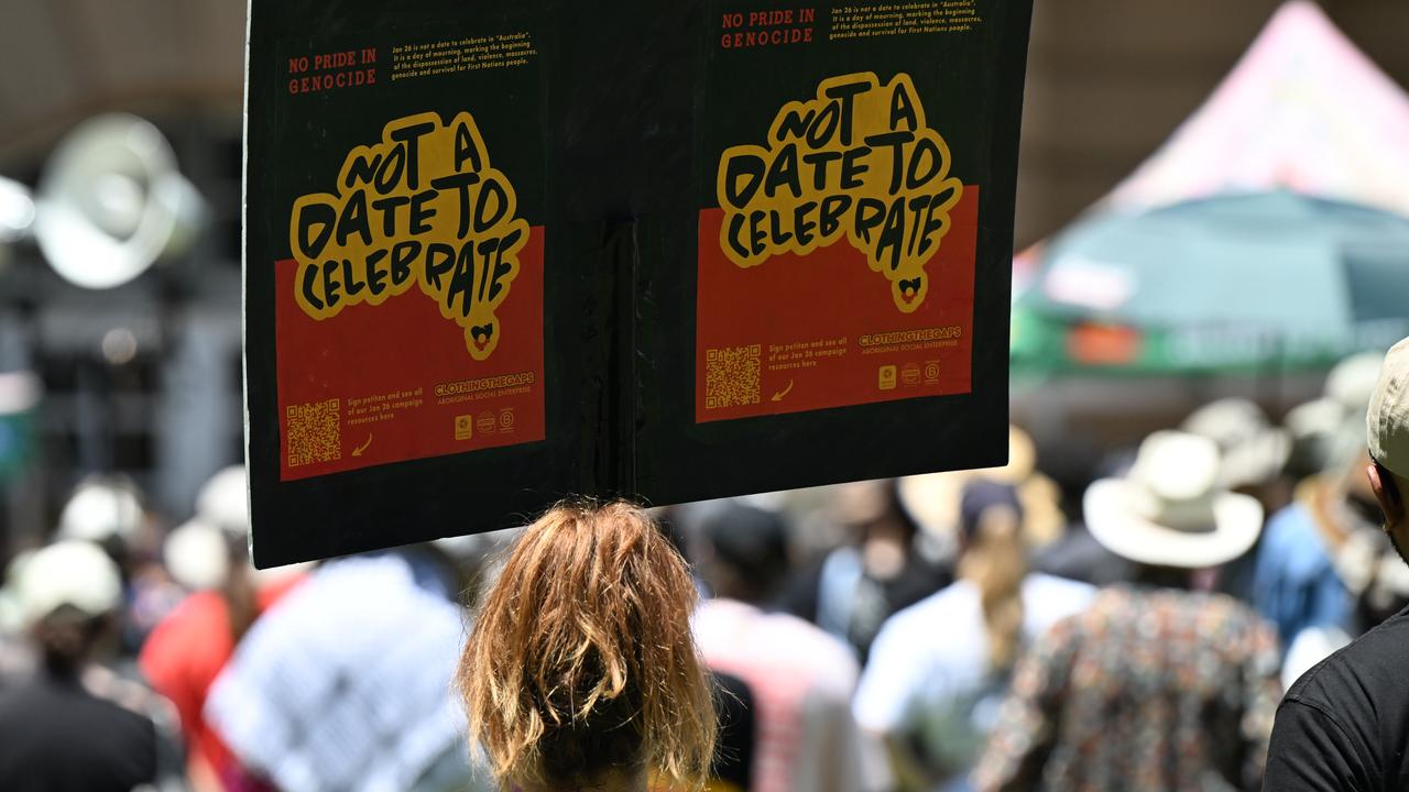 Protesters are seen during an Invasion Day rally in Brisbane