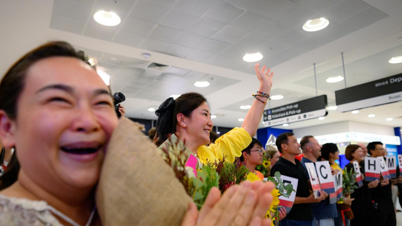 Passengers on a flight from Dubai arrive in Sydney
