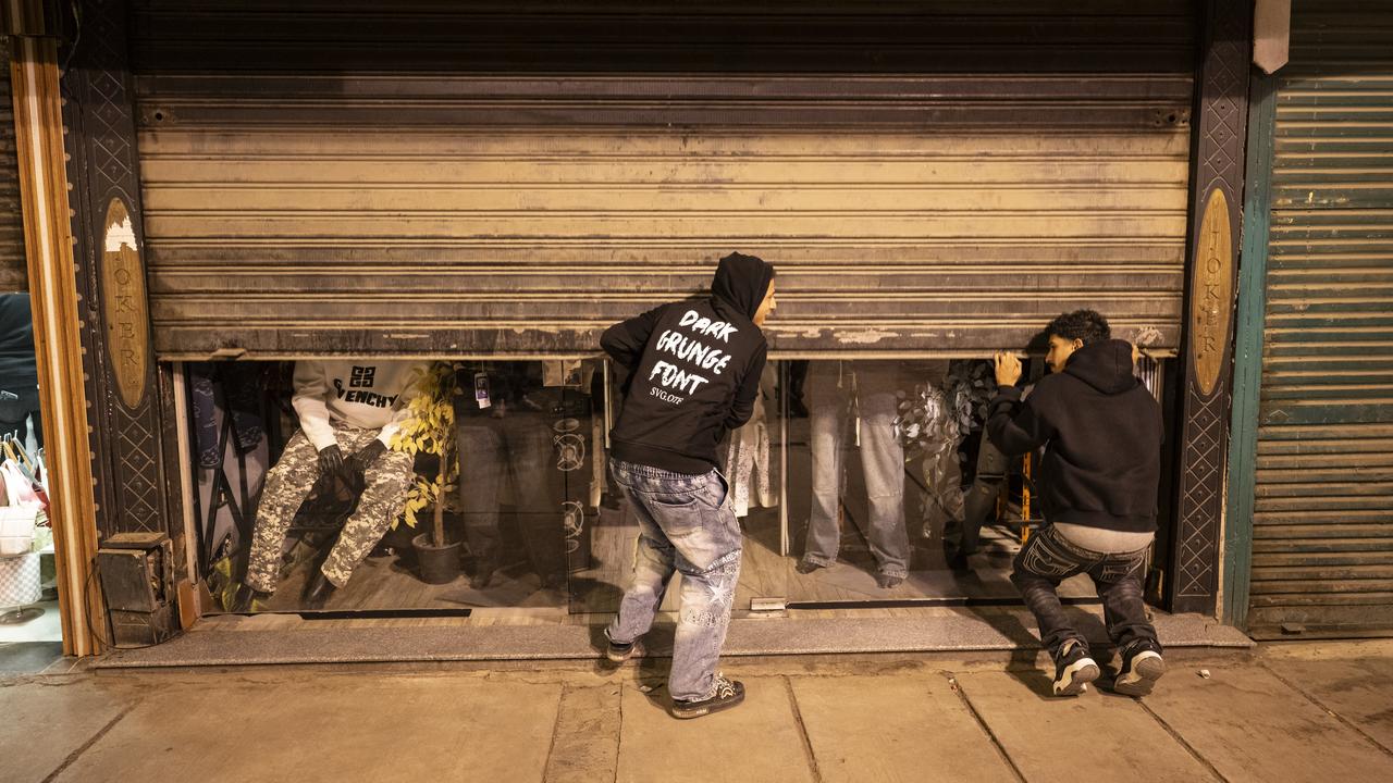 Two men close a shop