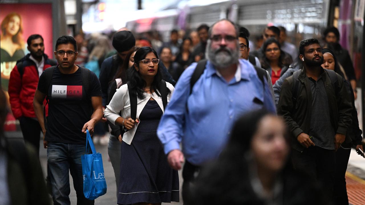 People are seen disembarking a V/Line train