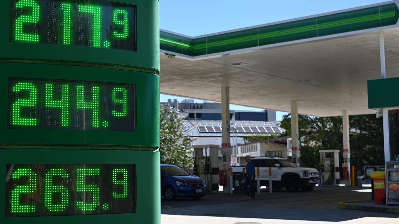 Fuel prices are displayed at a petrol station