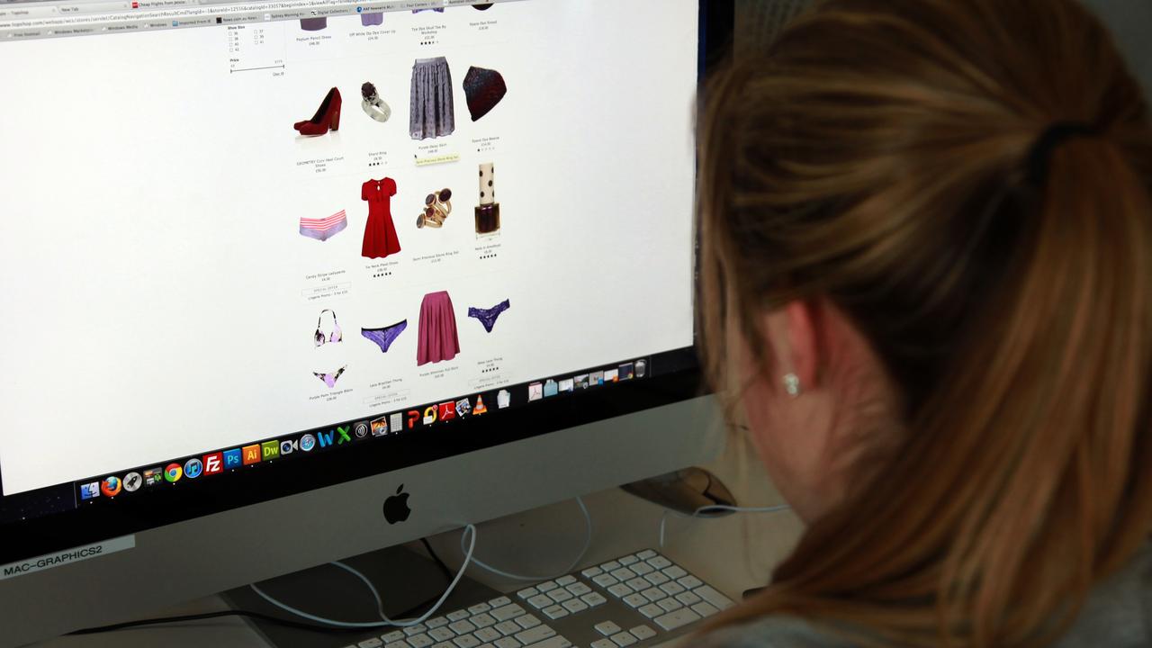 A woman looks at an online clothes store (file image)