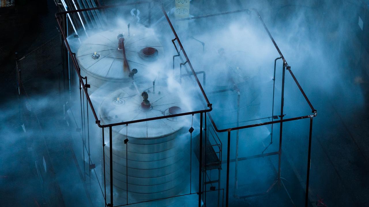 Overheated tank being sprayed with water