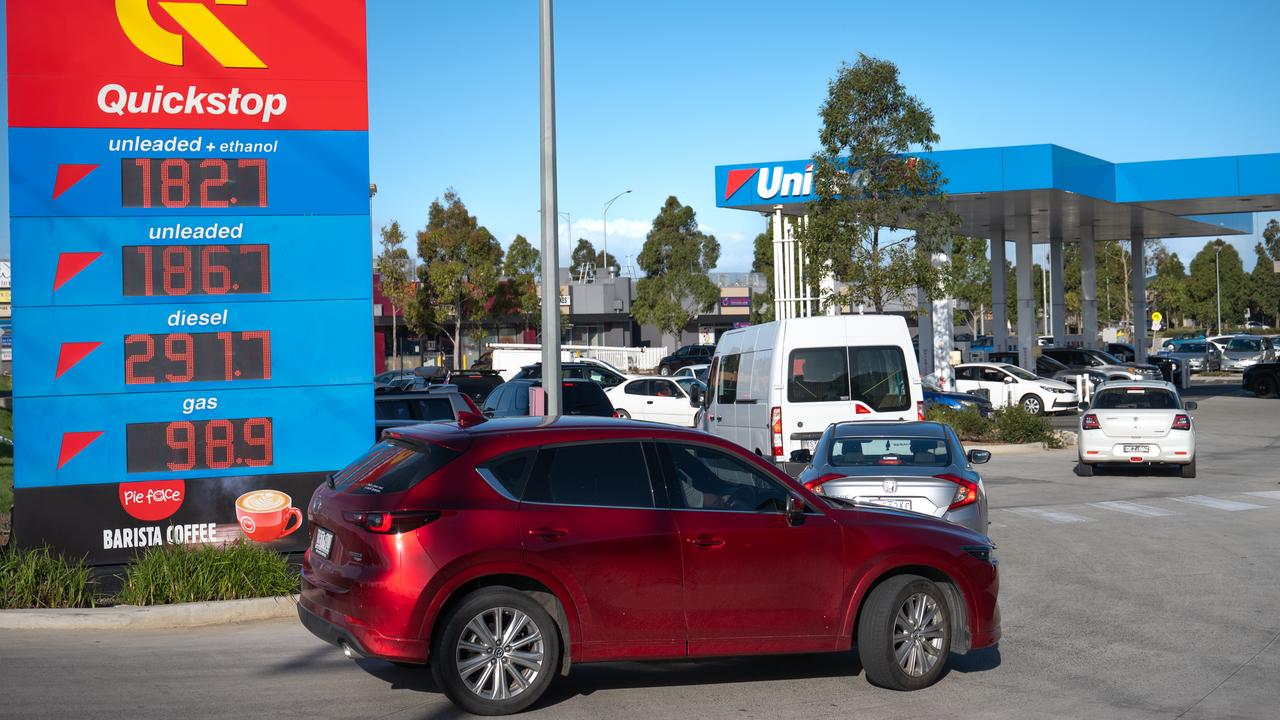 Motorists fill their vehicles with petrol (file image)