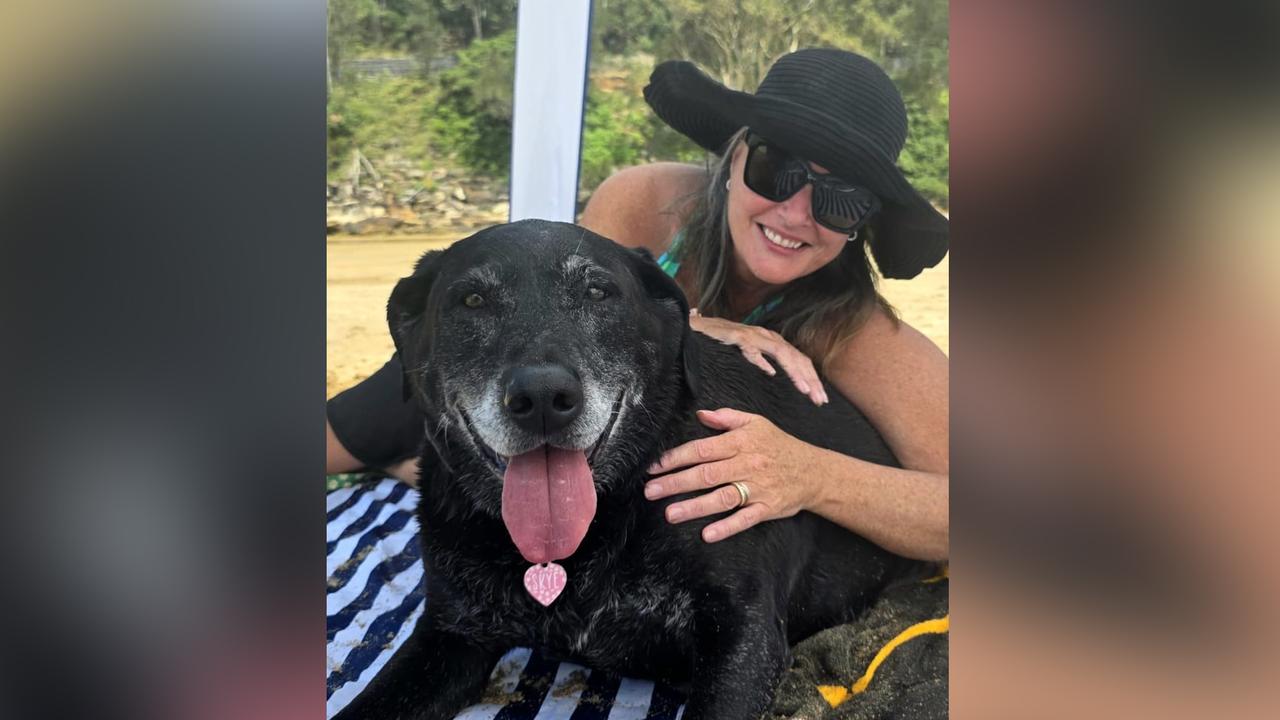 Natalie Moses poses with her dog Skye