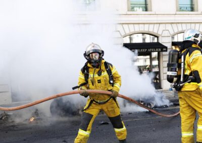 Protesters smash windows, set Tesla ablaze in G7 march