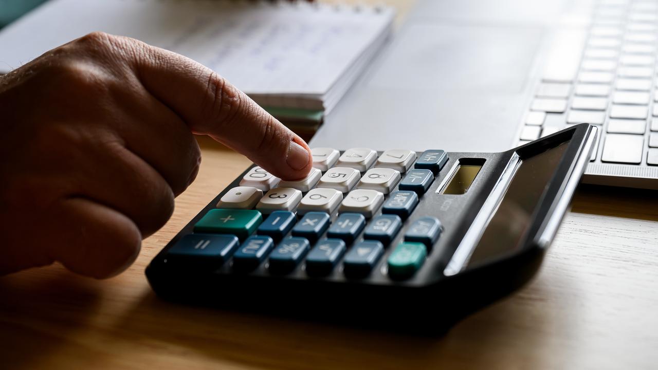 A person using a calculator (file image)