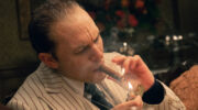 Al Capone lights a cigar