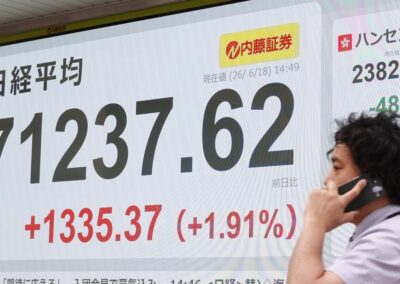 Asia tocks set records in Japan, dollar gets Fed boost