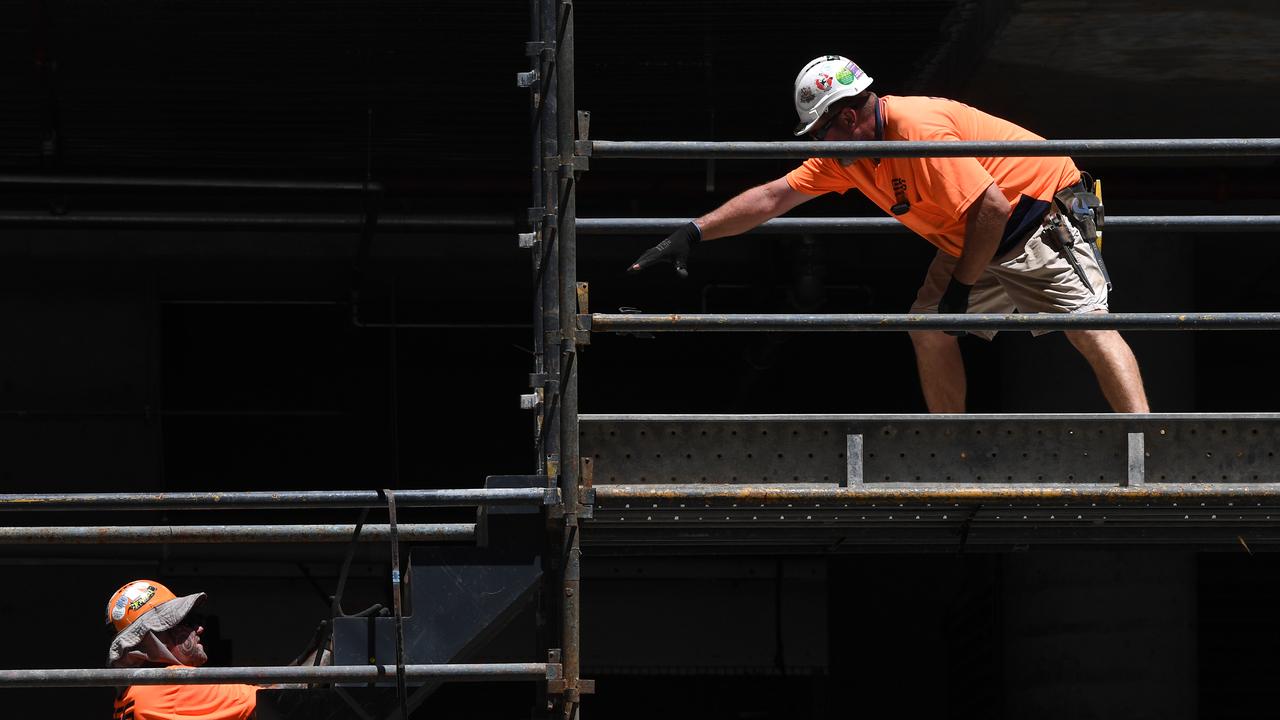 one construction worker points at another