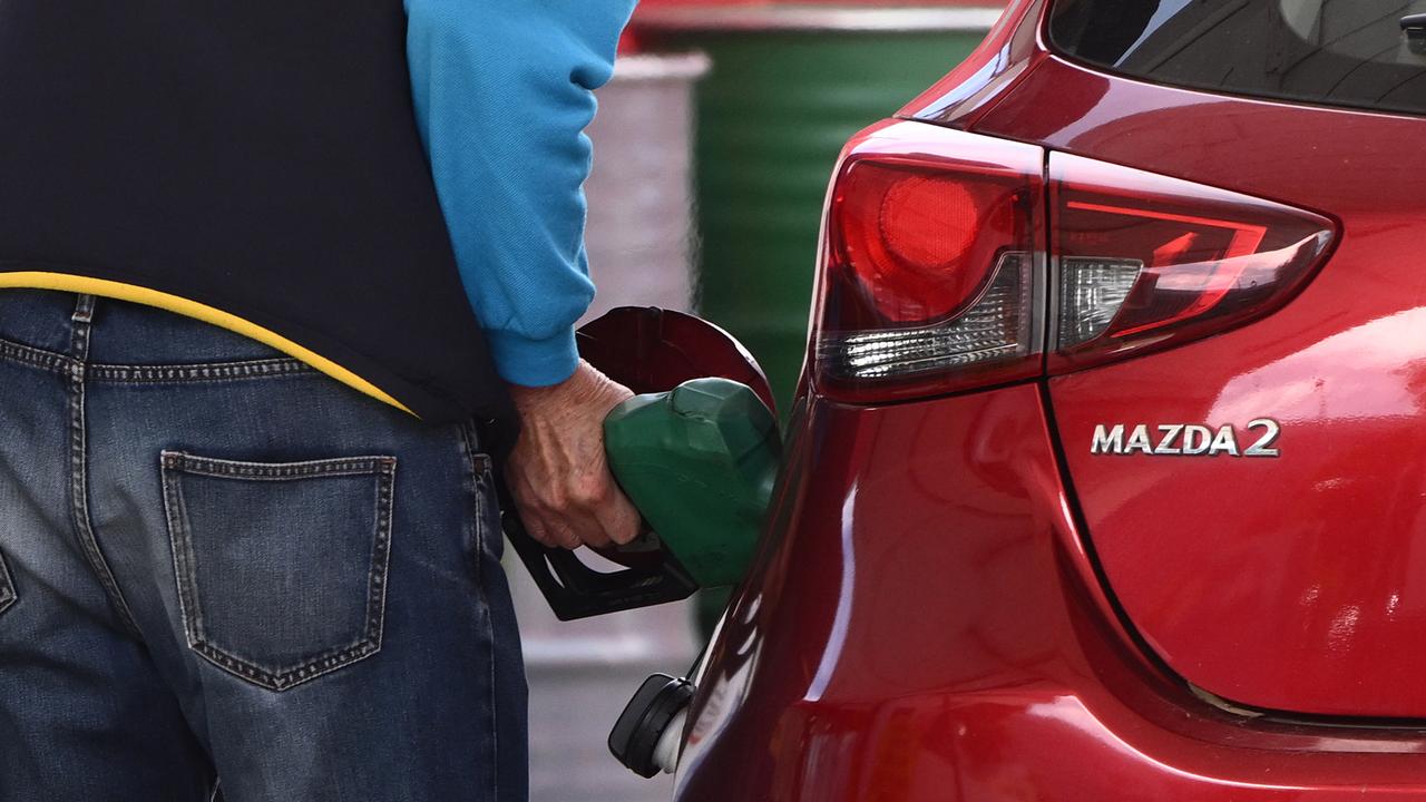 A customer at a fuel pump (file)