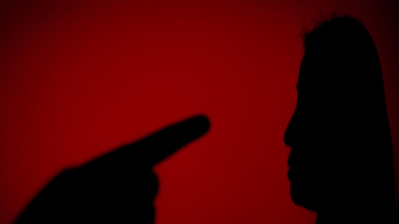 Generic image of a woman being threatened