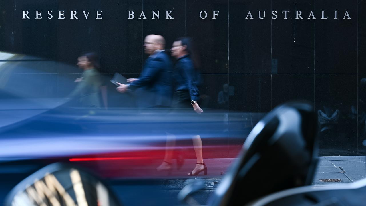 People walk past the Reserve Bank of Australia