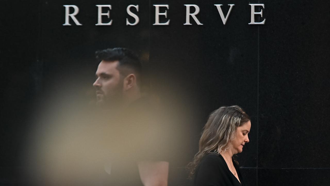 People walk past the Reserve Bank of Australia in Sydney