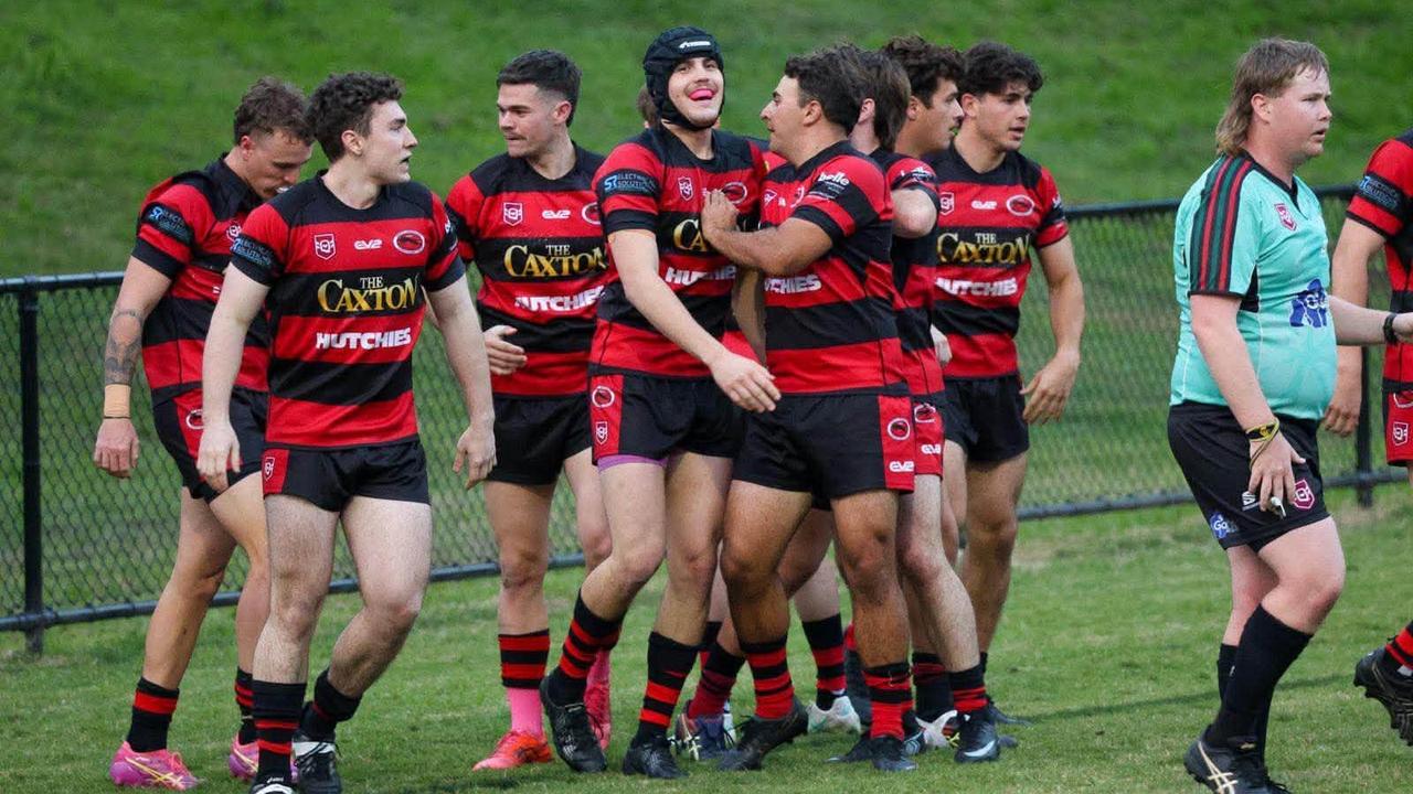 Wests Brisbane Junior Rugby League Club players celebrating. 