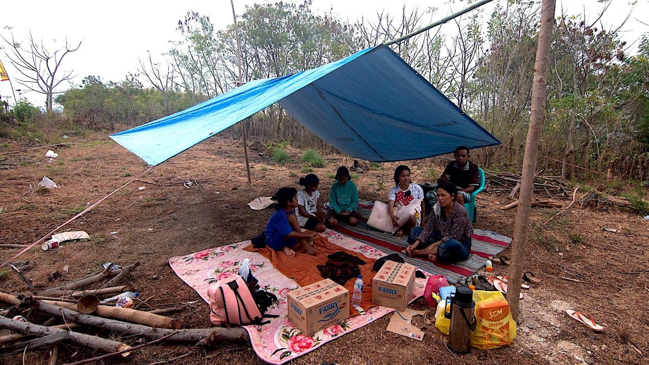 Residents set up a makeshift tent