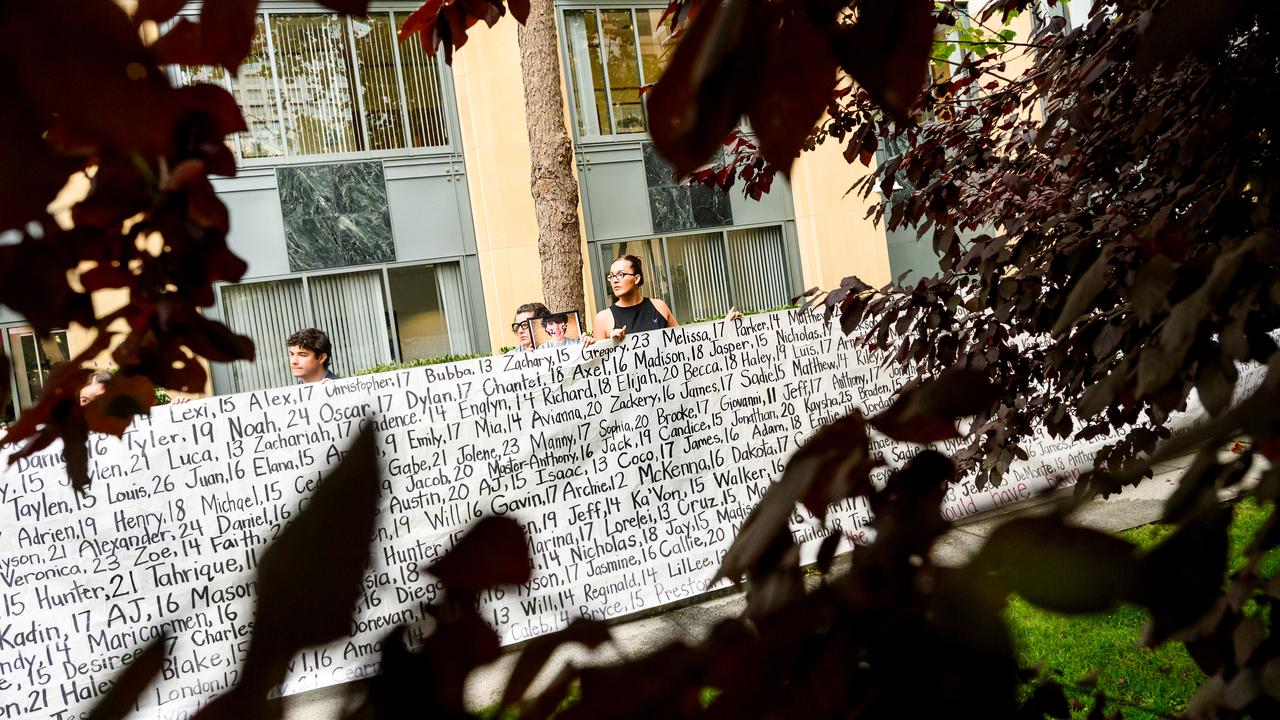 A banner with the names of dead children