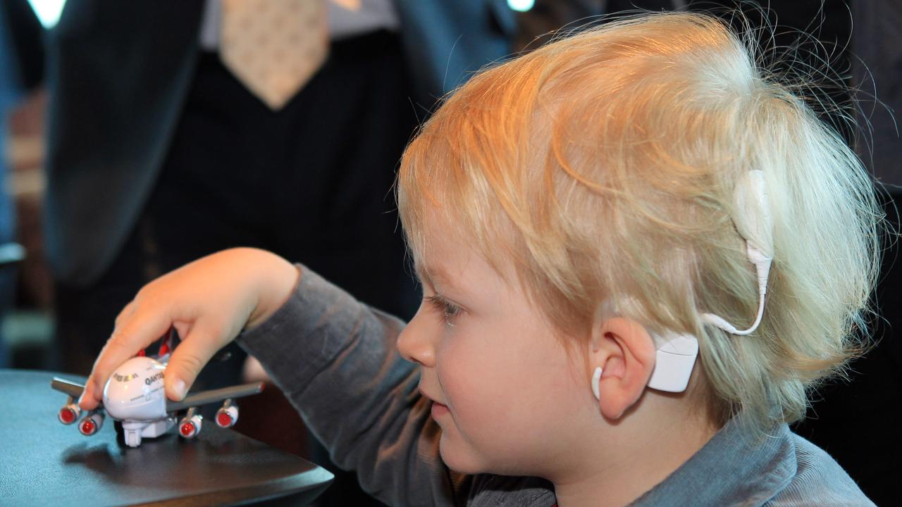 A young boy with a Cochlear implant