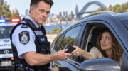 Chris Minns in police uniform