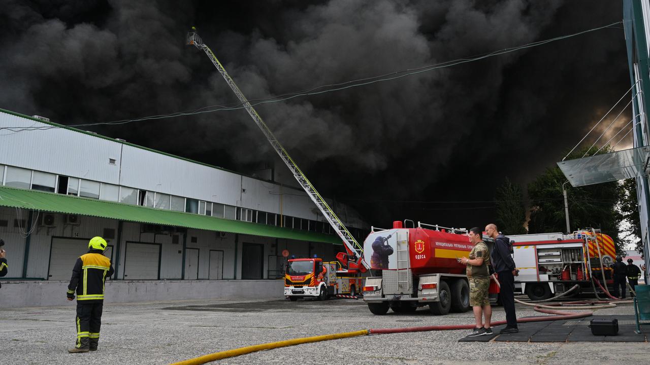 Firefighters put out a fire at warehouse stores