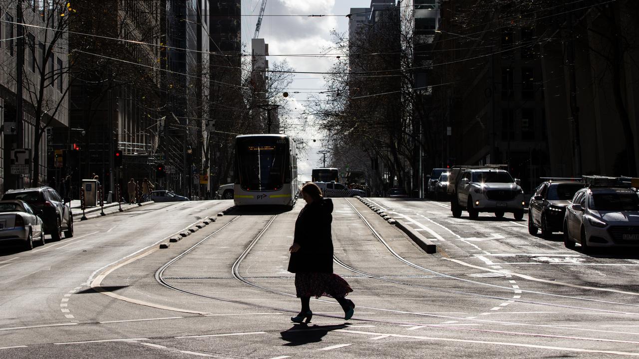 A person is seen walking in Melbourne,