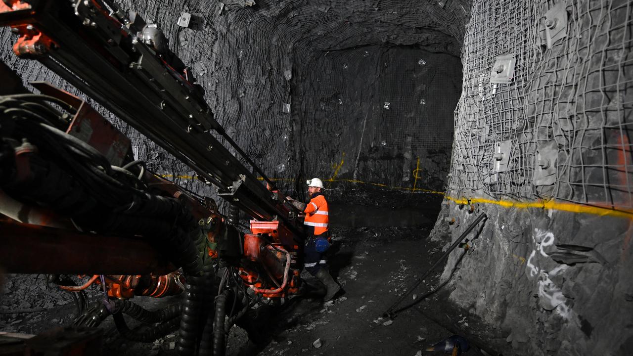A worker underground at the Harmony CSA Copper Mine