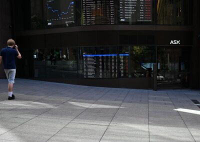 Aussie shares sink back into red as bond yields spike