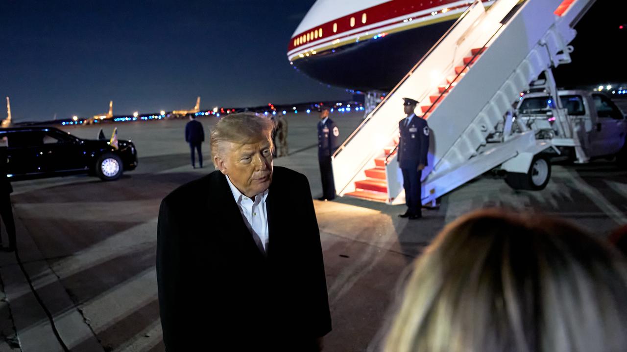 President Donald Trump speaks to reporters outside Air Force One.