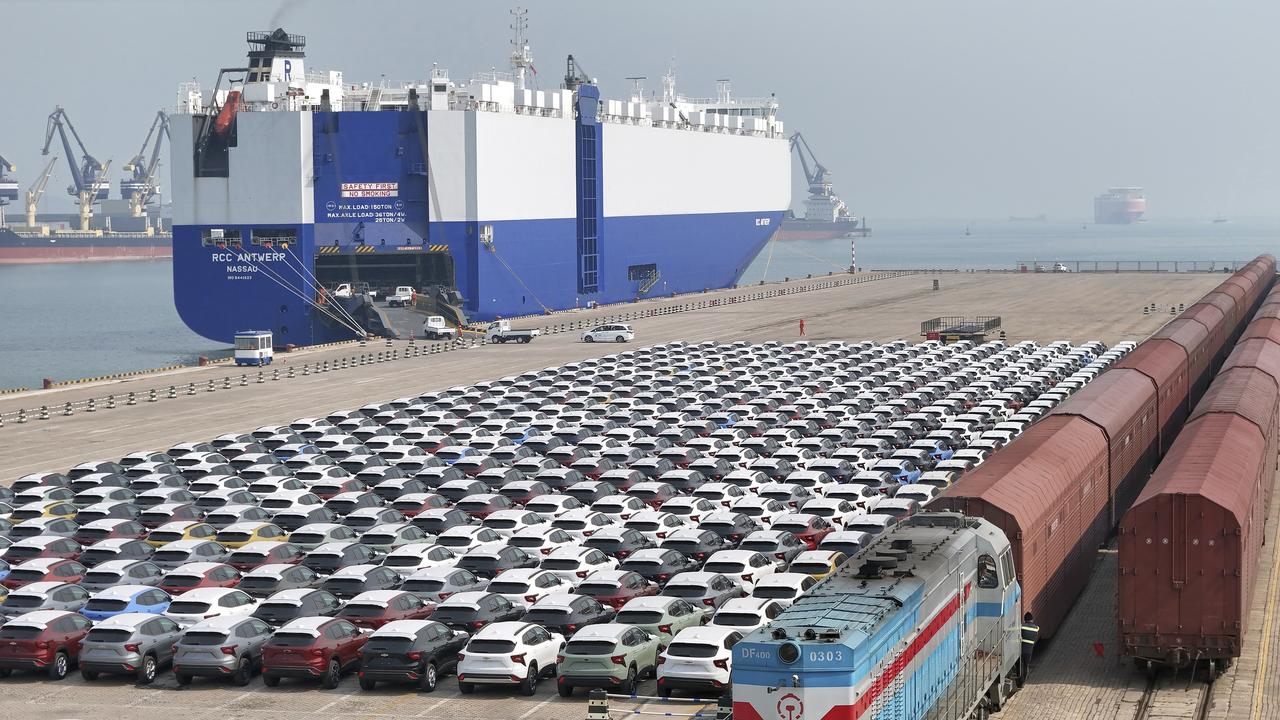 A freight train carrying cars to be exported