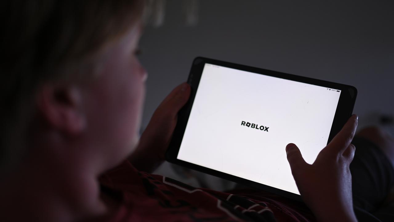 A boy plays a Roblox game