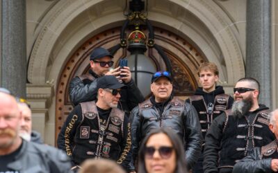 Riders rally over potholes as land tax cut locked in