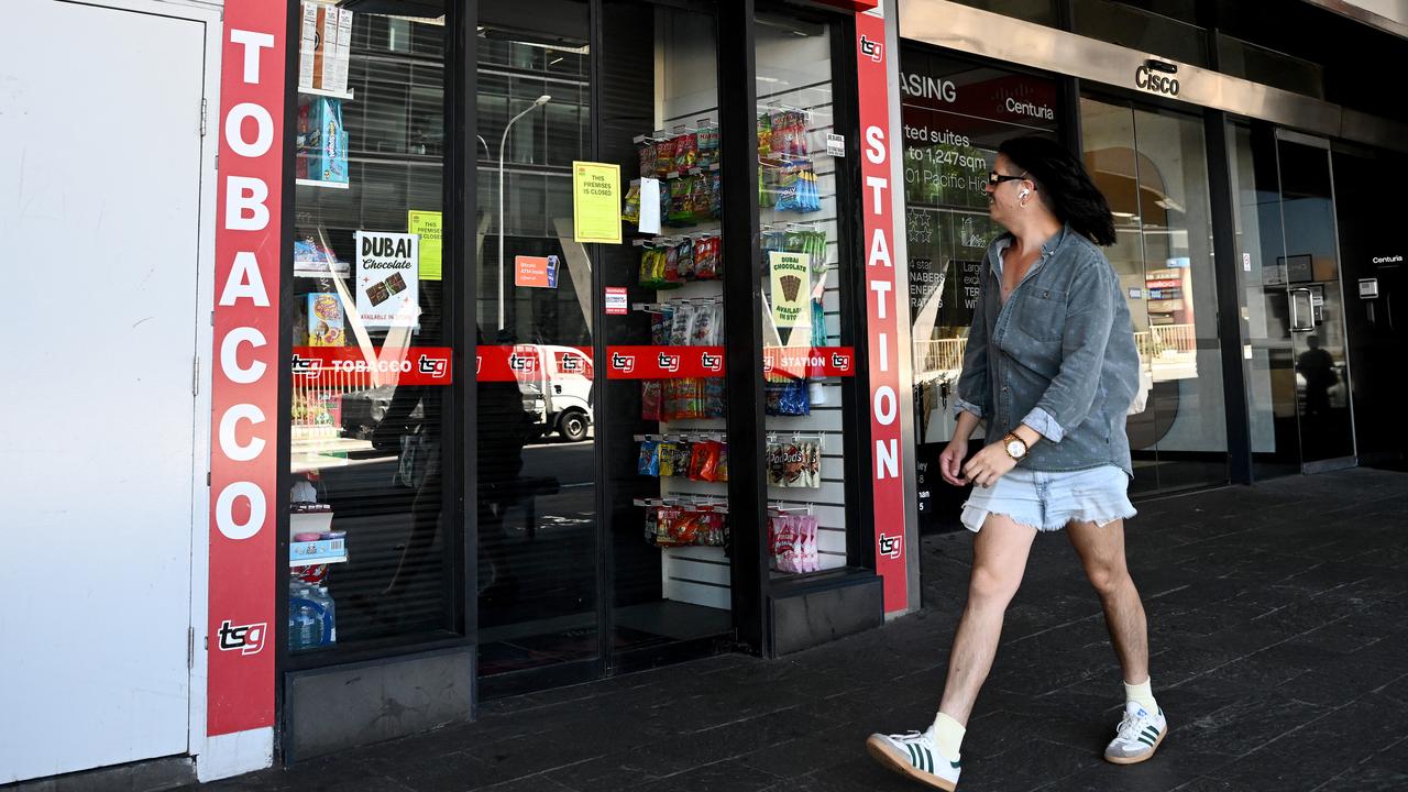 A person walks past a closed tobacco store (file image)