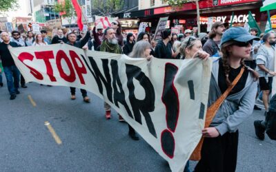 Protesters rally outside controversial weapons expo
