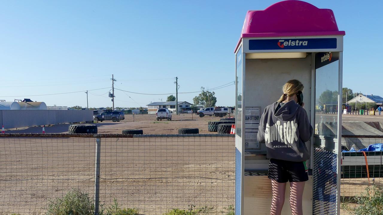 A woman in a phone booth