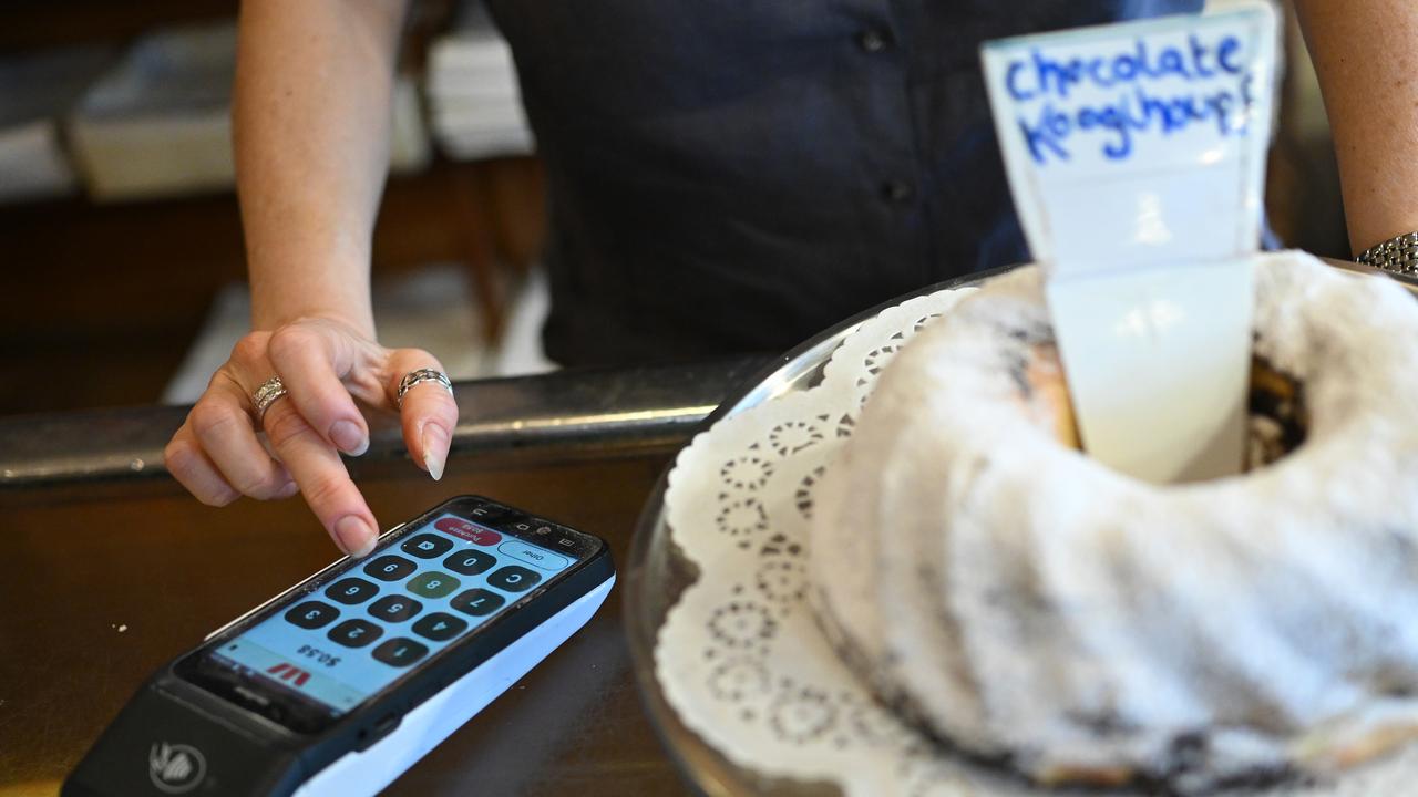 A small business owner with a card machine