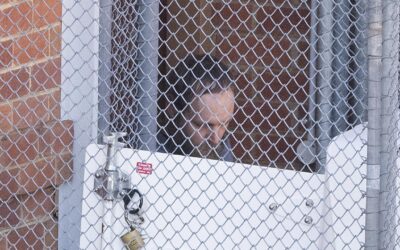 Silent, staring: alleged MP attacker appears in court