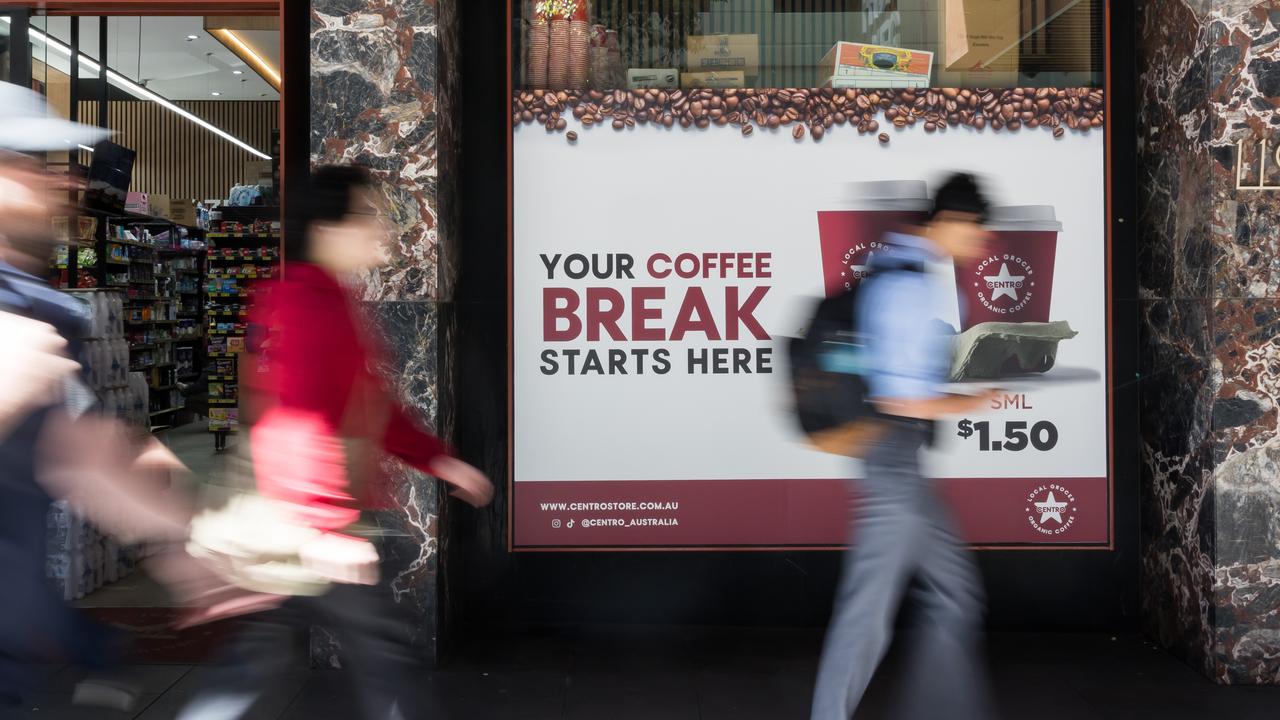 People pass by shopfronts (file image)