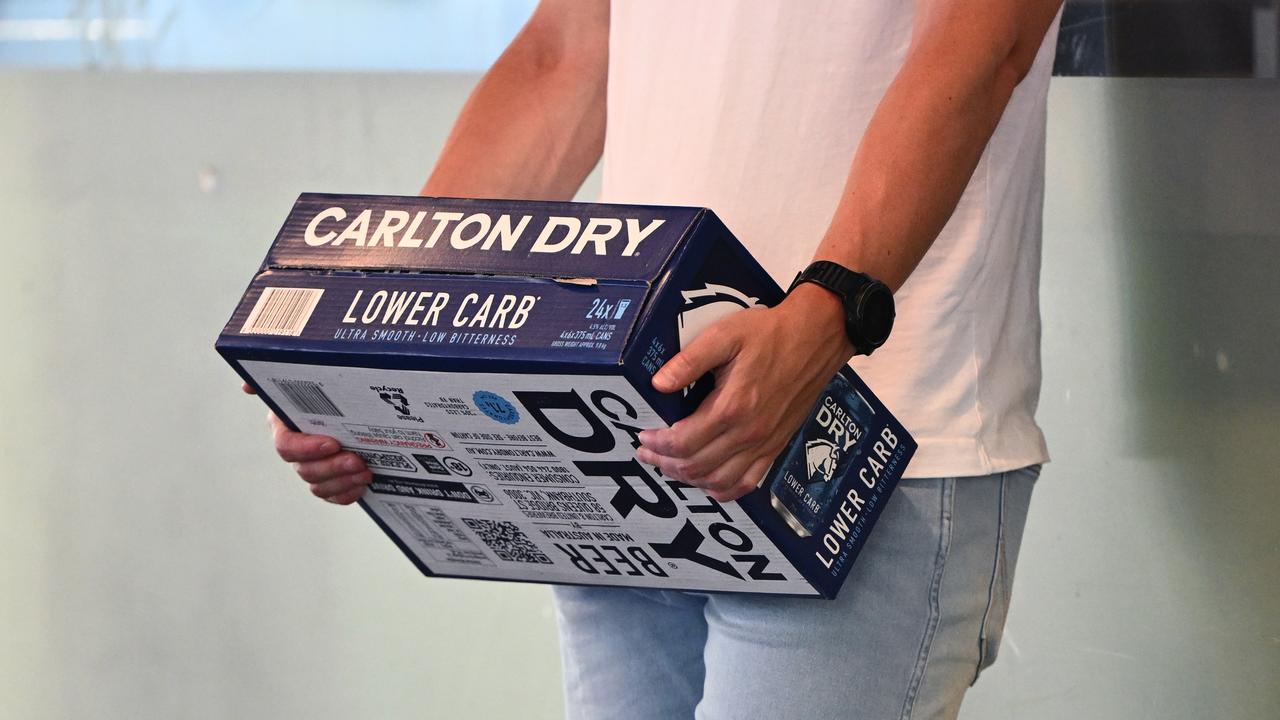 A person holding a slab of beer (file image)